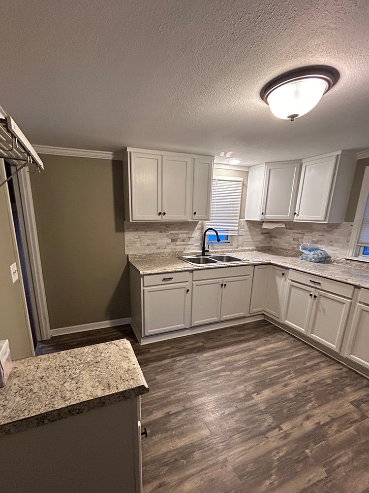 2 story home addition — completed kitchen with white cabinets and granite countertops — Findlay, Ohio