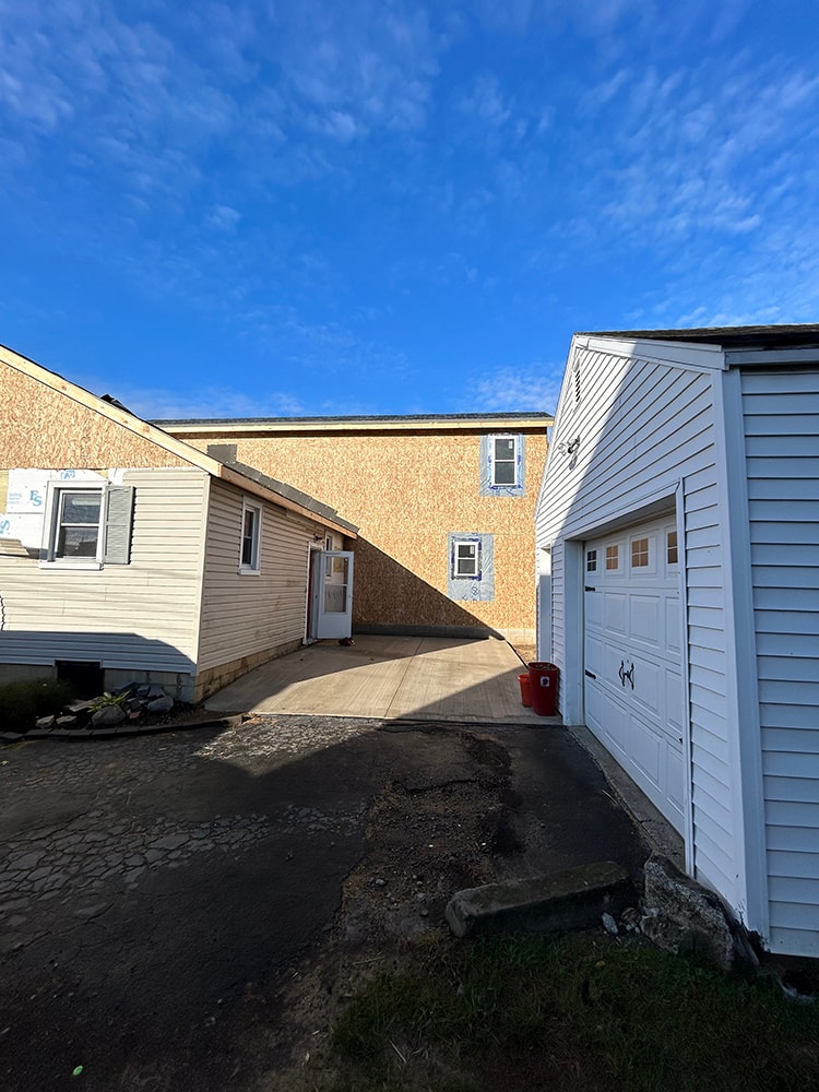 2 story home addition — framing stage rear view with second story sheathing — Findlay, Ohio