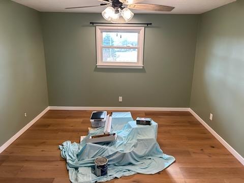 Bathroom/closet addition — after: completed bedroom interior with sage green walls and hardwood flooring — Findlay, Ohio