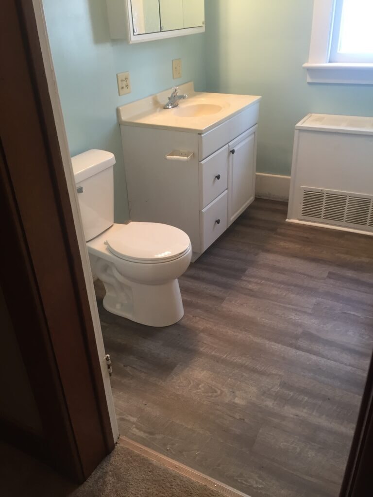 Finished bathroom remodel with new flooring, tub surround, and vanity — Findlay, Ohio