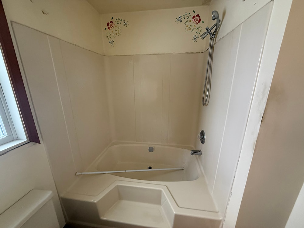 Before: original tub and shower enclosure — Findlay, Ohio