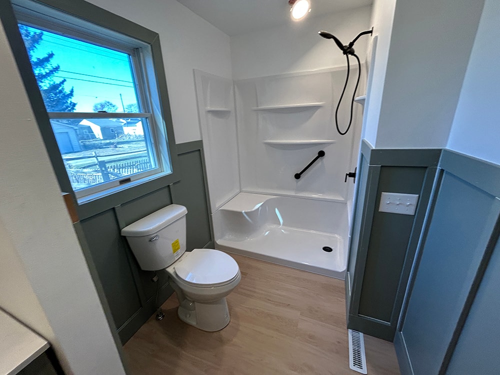 After: new double vanity with black fixtures and arched mirrors — Findlay, Ohio