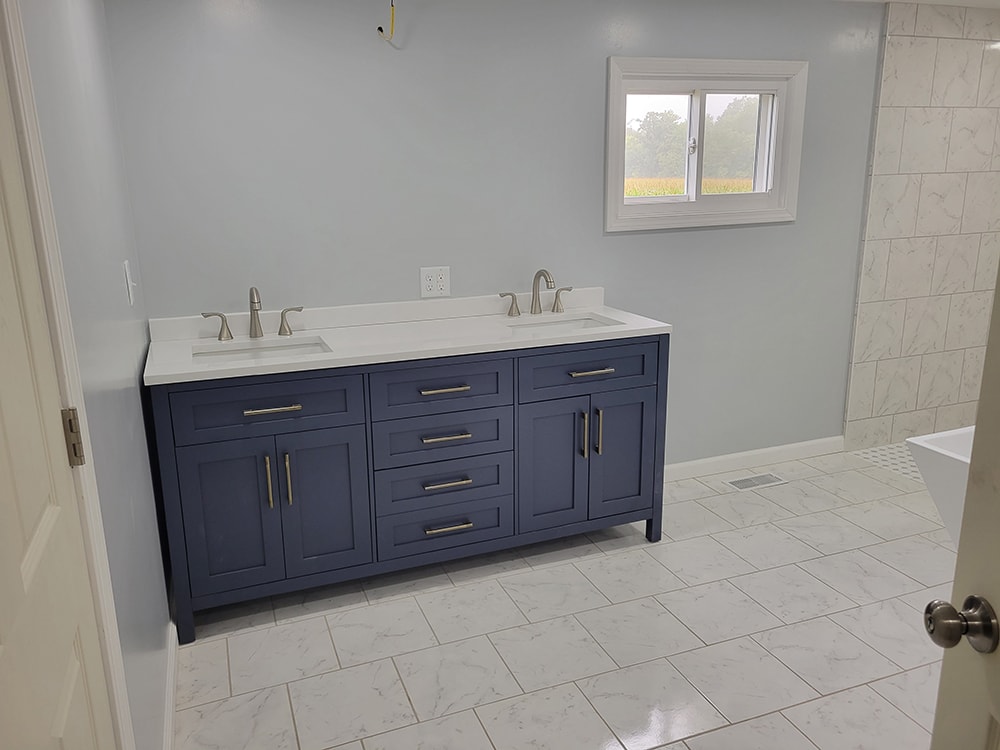 Entire house remodel — after: completed bathroom with new tile floor and shower surround — Arlington, Ohio