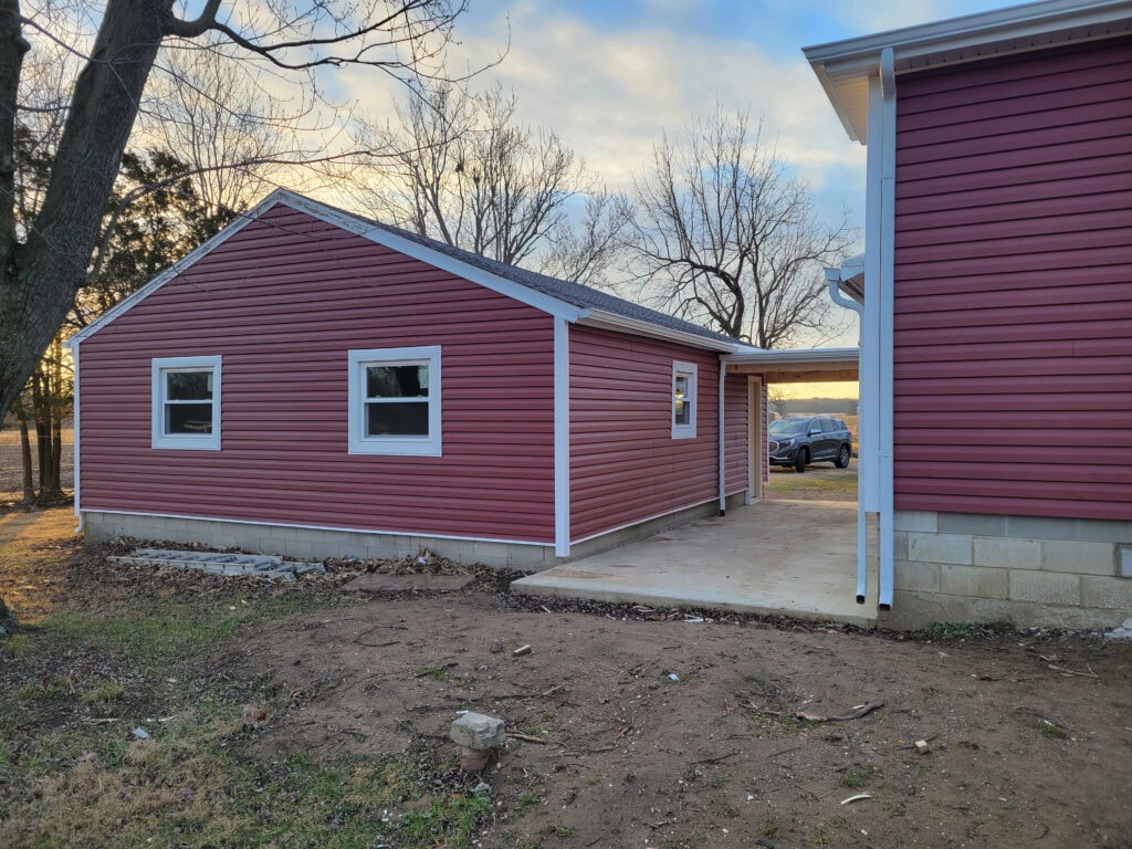 Entire house remodel — after: completed exterior rear view with new siding and roof — Arlington, Ohio