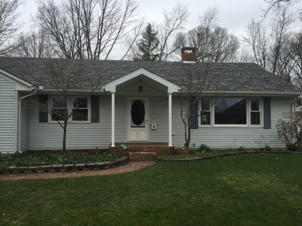 Completed front porch gable roof addition with white columns — Findlay, Ohio