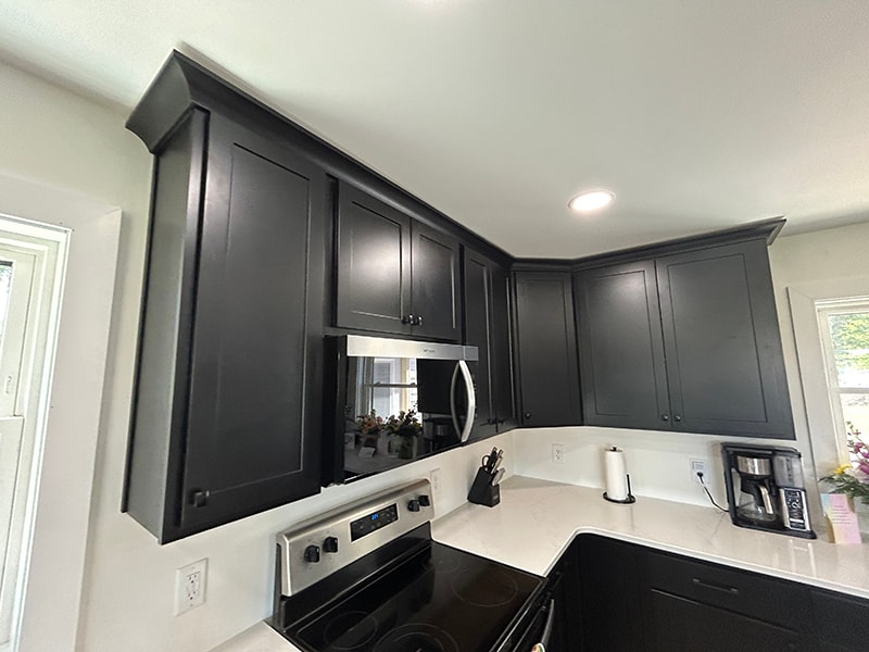 Completed kitchen remodel — dark upper cabinets with stainless appliances — Findlay, Ohio