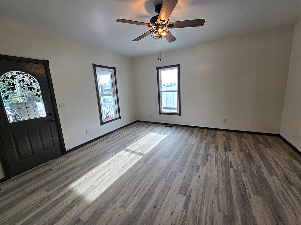 2 additions home remodel — after living room with new flooring and front door — Findlay, Ohio