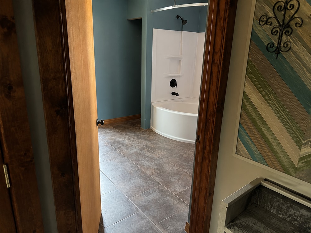 2 additions home remodel — before bathroom with blue walls and tile floor — Findlay, Ohio