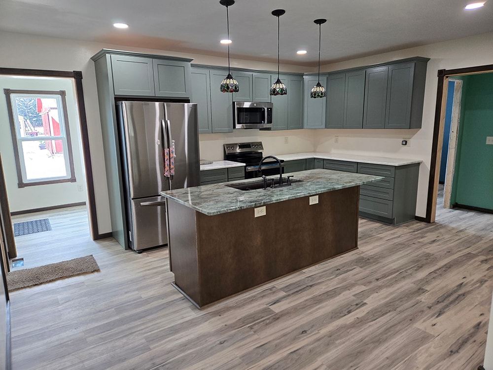 2 additions home remodel — completed kitchen with gray cabinets and island — Findlay, Ohio