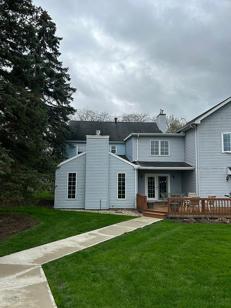 New siding — during: close view of new window build-outs and trim wrapping on white siding section, rural Ohio
