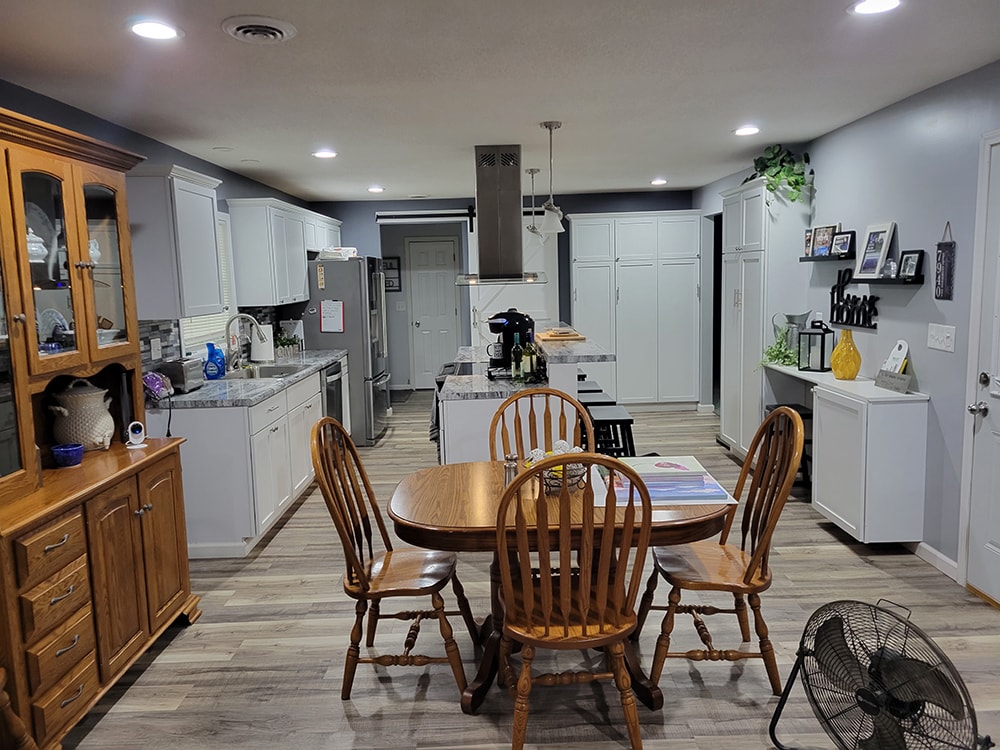 Kitchen remodel Findlay — after: open concept kitchen and dining area with new flooring, Findlay, Ohio
