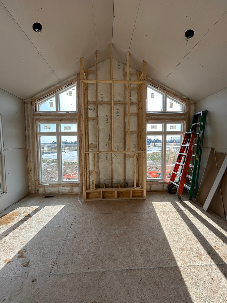 Large home addition interior — framing stage with vaulted ceiling and windows — Findlay, Ohio