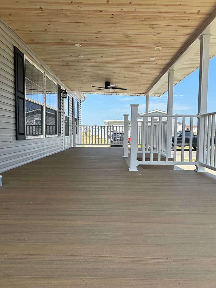 New composite deck with roof — cedar tongue-and-groove ceiling with ceiling fan from deck surface — Findlay, Ohio