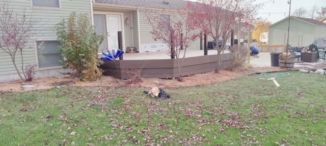 New composite deck — after: completed deck platform with dark composite boards and no railing yet — Findlay, Ohio