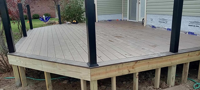 New composite deck — during construction: composite decking installed with black posts and framing exposed — Findlay, Ohio