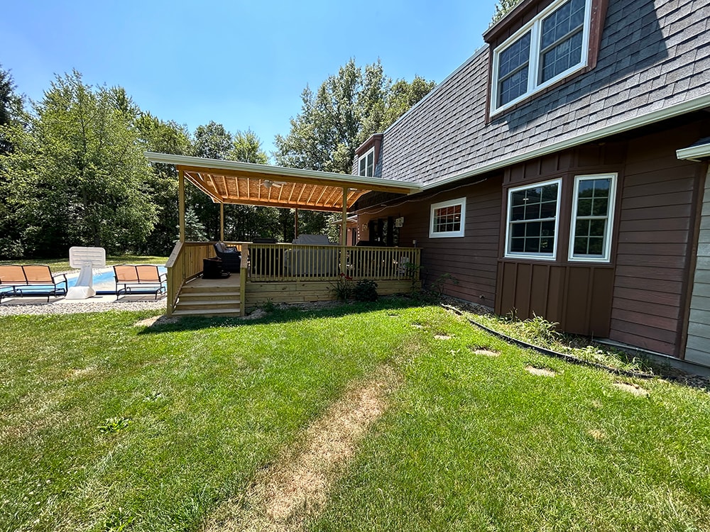 New treated deck with gable cover and pool extension — McComb, Ohio