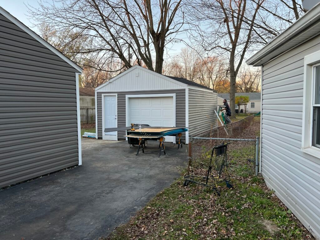 New vinyl siding — garage after installation with gray siding, Fostoria, Ohio
