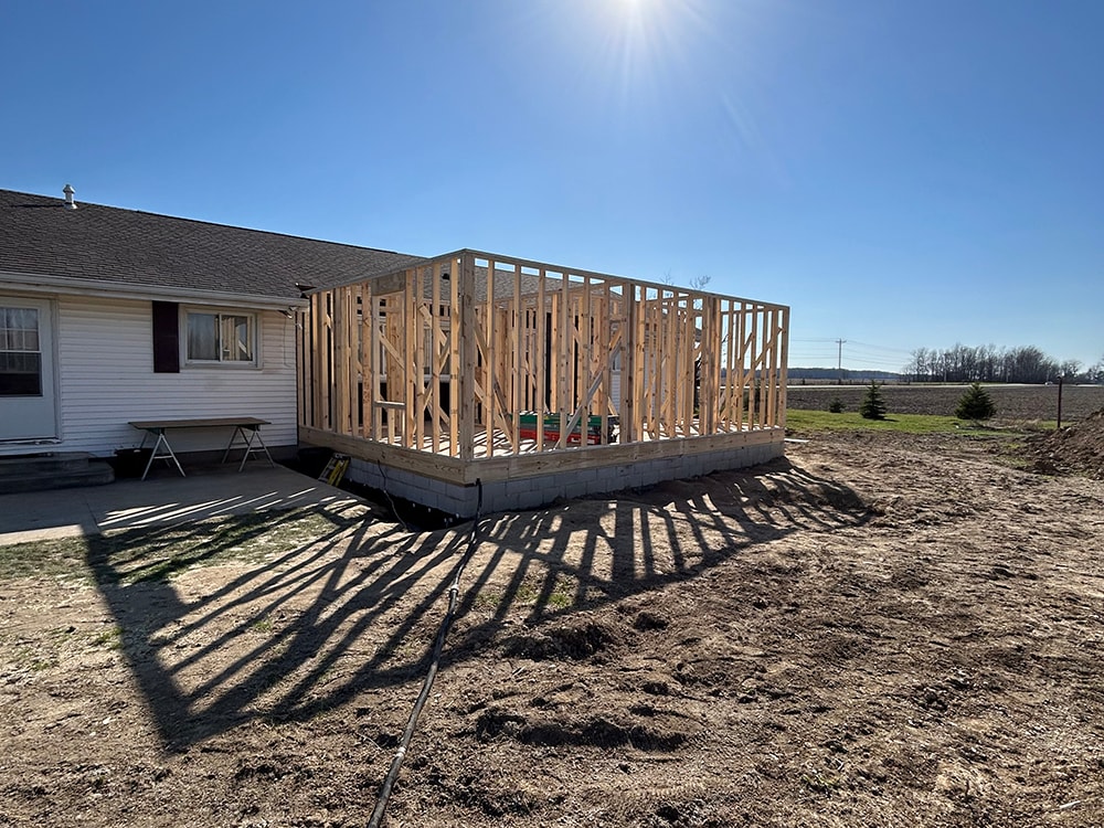 Home addition — framing stage open stud walls with block foundation — Findlay, Ohio
