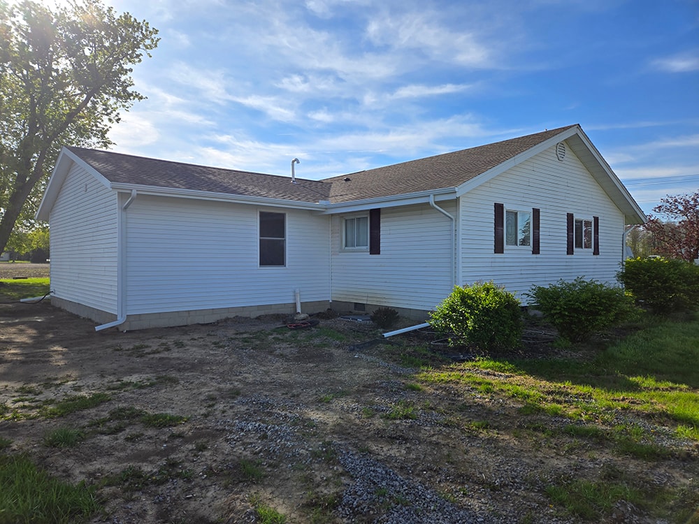 Home addition — completed exterior full rear view with new siding blending into original home — Findlay, Ohio