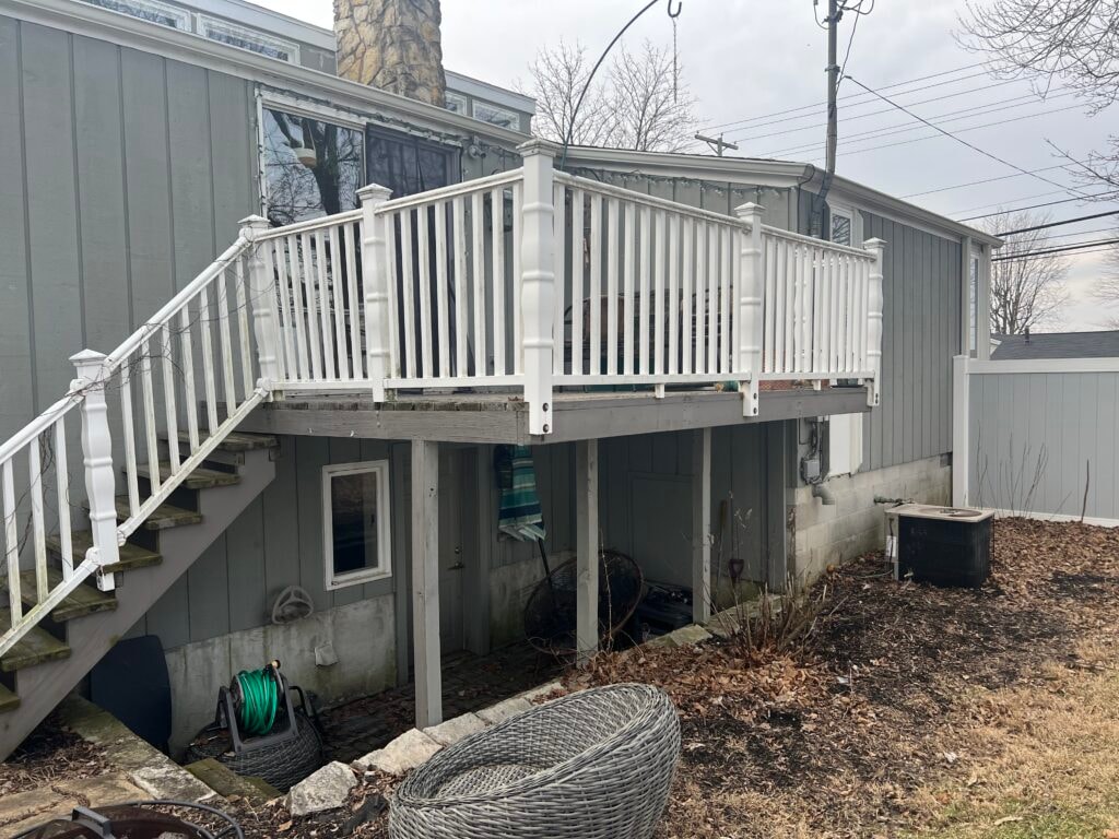 Siding, deck, flooring and stairs — rear deck before, old weathered deck with white railing, Findlay, Ohio