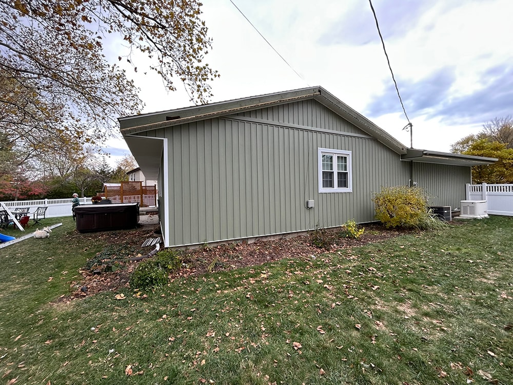 New board and batten siding — rear corner with hot tub — Findlay, Ohio