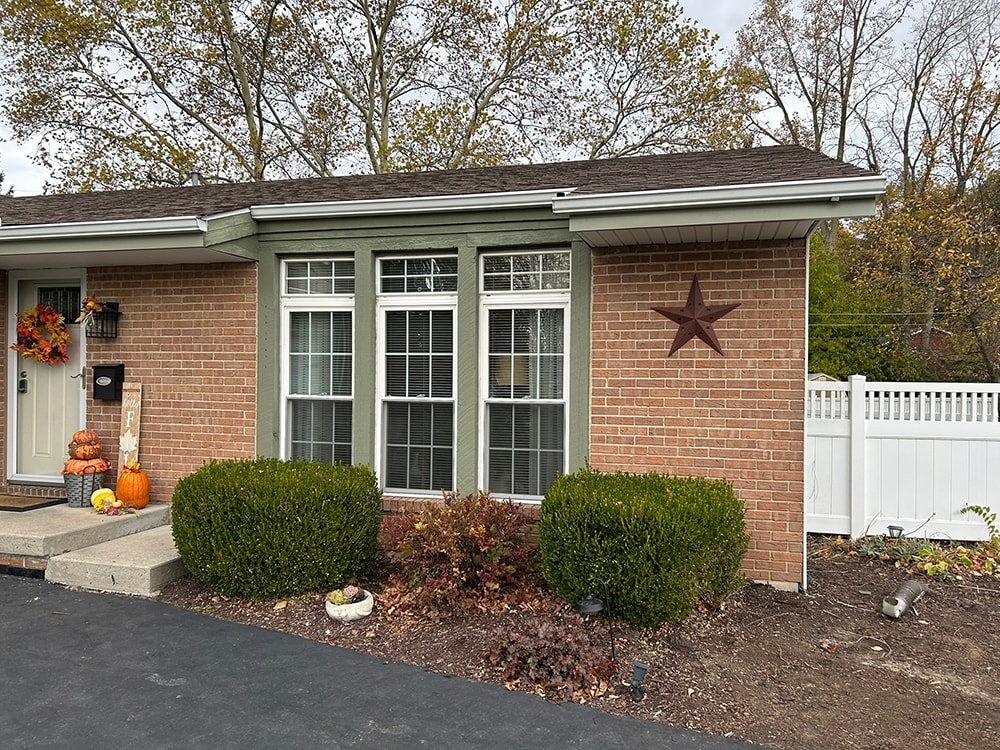 New board and batten siding — front brick facade with new windows — Findlay, Ohio