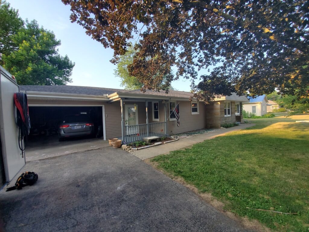 Front of home with new blue vinyl siding installed — Findlay, Ohio