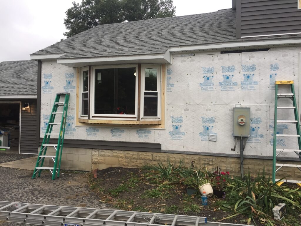 Siding and new windows Findlay — during: new bay window installed in rough opening with PolarWrap house wrap on surrounding wall, Findlay, Ohio