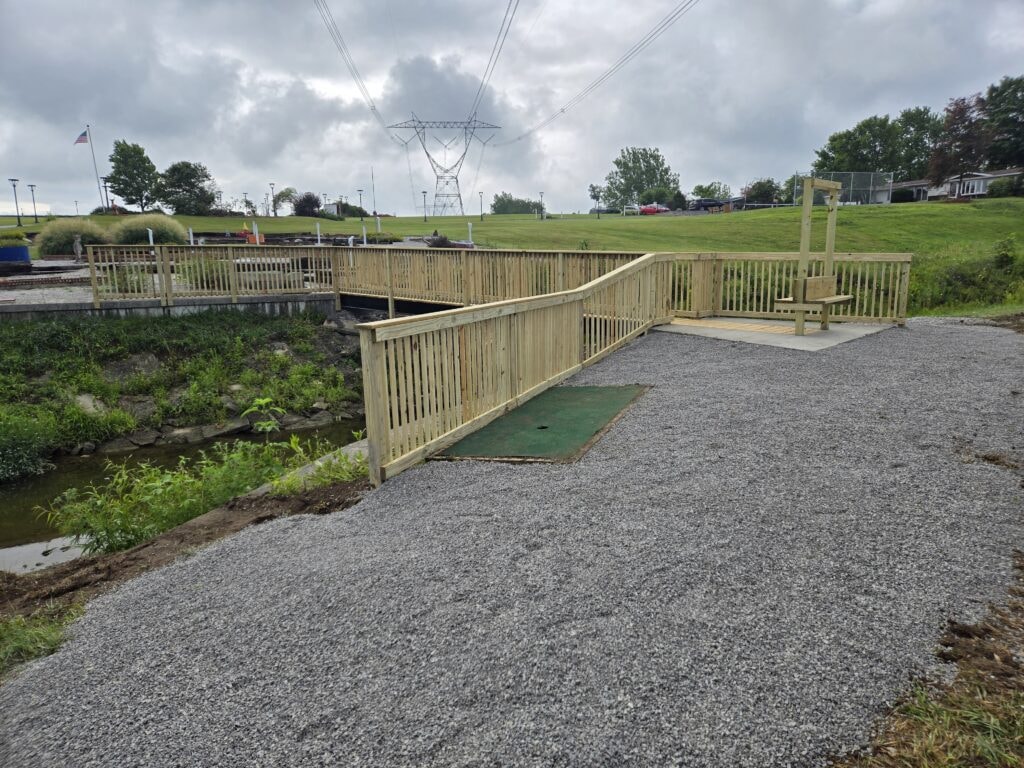 Steel and treated wood bridges — bridge 1 completed with wood railings and gravel approach — Findlay, Ohio