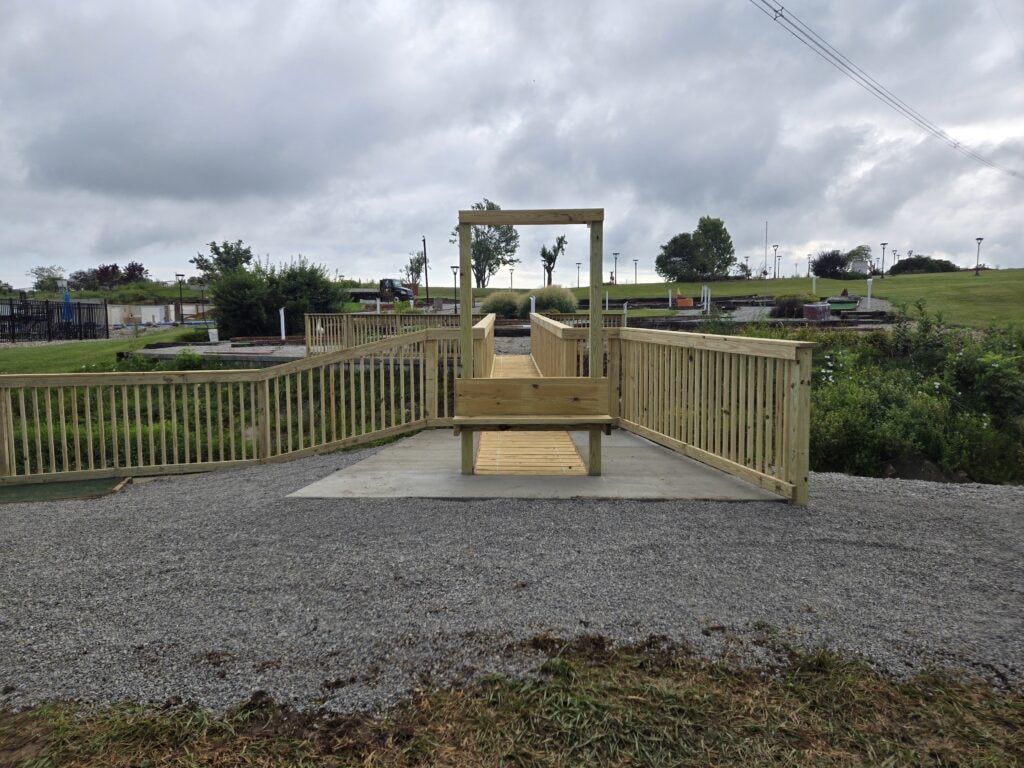 Steel and treated wood bridges — bridge 1 completed side view with wood railings and gravel — Findlay, Ohio